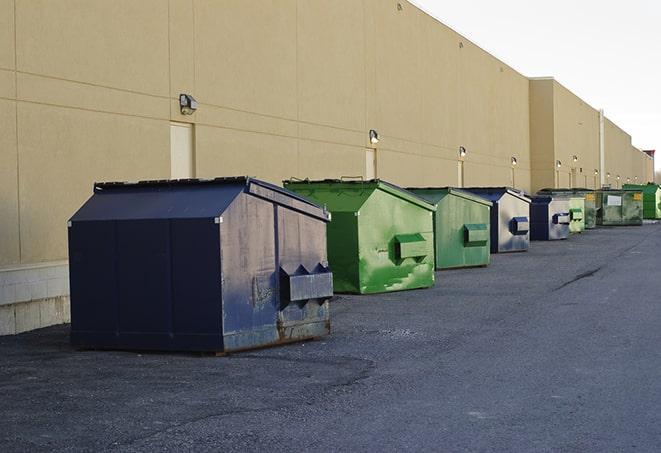 a stack of yellow construction dumpsters on a job site in Arrington TN